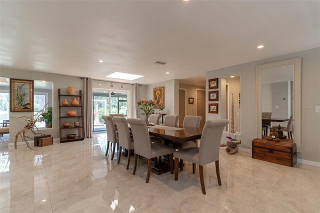 18101 Boy Scout Rd, Odessa, FL 33556 - dining area with recessed lighting, a skylight, baseboards, and light marble finish flooring