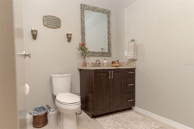 18101 Boy Scout Rd, Odessa, FL 33556 - bathroom featuring vanity, toilet, baseboards, and tile patterned flooring