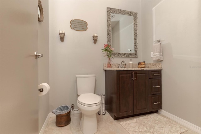 18101 Boy Scout Rd, Odessa, FL 33556 - bathroom featuring vanity, toilet, baseboards, and tile patterned flooring