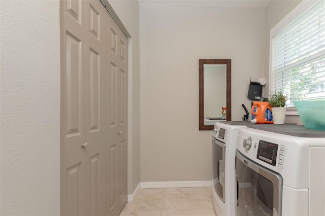 18101 Boy Scout Rd, Odessa, FL 33556 - laundry area with washing machine and clothes dryer and baseboards