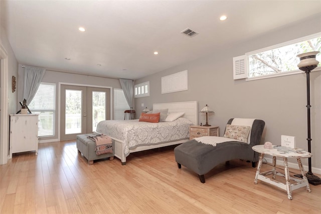 18101 Boy Scout Rd, Odessa, FL 33556 - bedroom featuring multiple windows, french doors, light wood finished floors, and recessed lighting