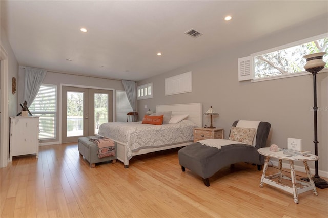 18101 Boy Scout Rd, Odessa, FL 33556 - bedroom with multiple windows, access to outside, light wood-type flooring, french doors, and recessed lighting