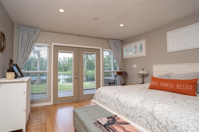 18101 Boy Scout Rd, Odessa, FL 33556 - bedroom with french doors, access to exterior, light wood-style floors, and recessed lighting
