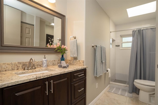18101 Boy Scout Rd, Odessa, FL 33556 - full bathroom with vanity, toilet, a skylight, tile patterned flooring, and tiled shower