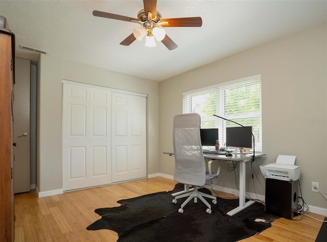 18101 Boy Scout Rd, Odessa, FL 33556 - home office featuring light wood-style flooring, baseboards, and a ceiling fan