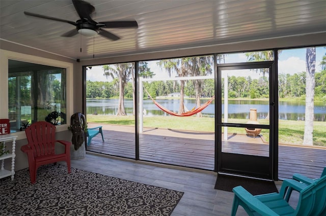 18101 Boy Scout Rd, Odessa, FL 33556 - sunroom with a water view, ceiling fan, and view of wooded area
