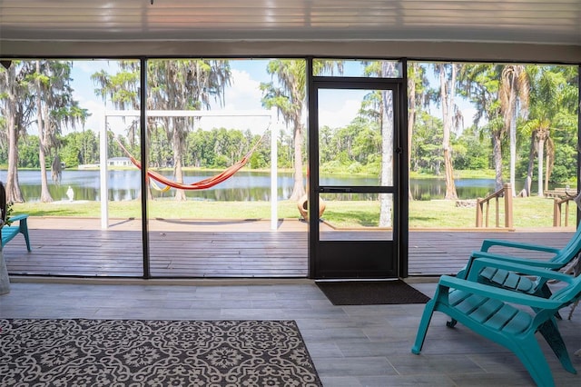 18101 Boy Scout Rd, Odessa, FL 33556 - entryway with a water view, view of scattered trees, and wood finished floors