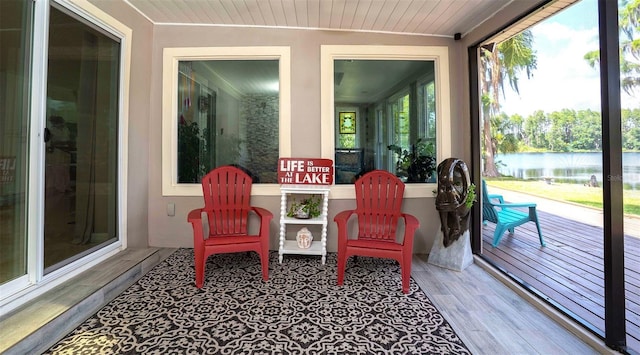 18101 Boy Scout Rd, Odessa, FL 33556 - sunroom / solarium featuring a water view, wood finished floors, and wood ceiling