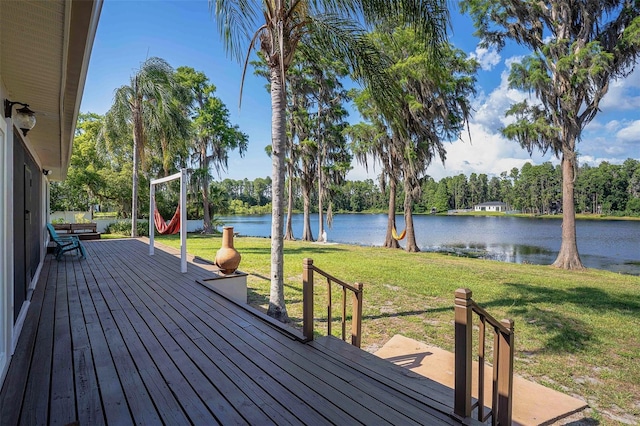 18101 Boy Scout Rd, Odessa, FL 33556 - wooden terrace featuring a water view, a lawn, and view of wooded area