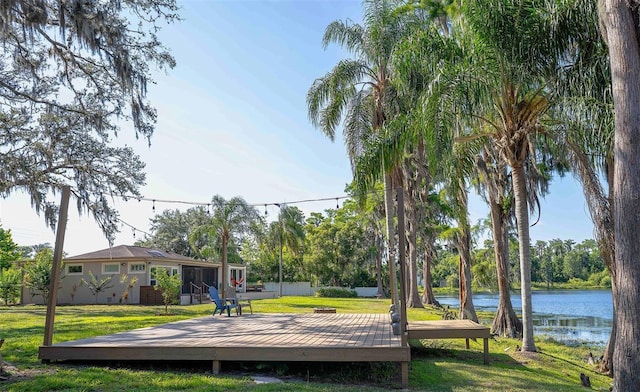 18101 Boy Scout Rd, Odessa, FL 33556 - dock featuring a deck with water view and a lawn