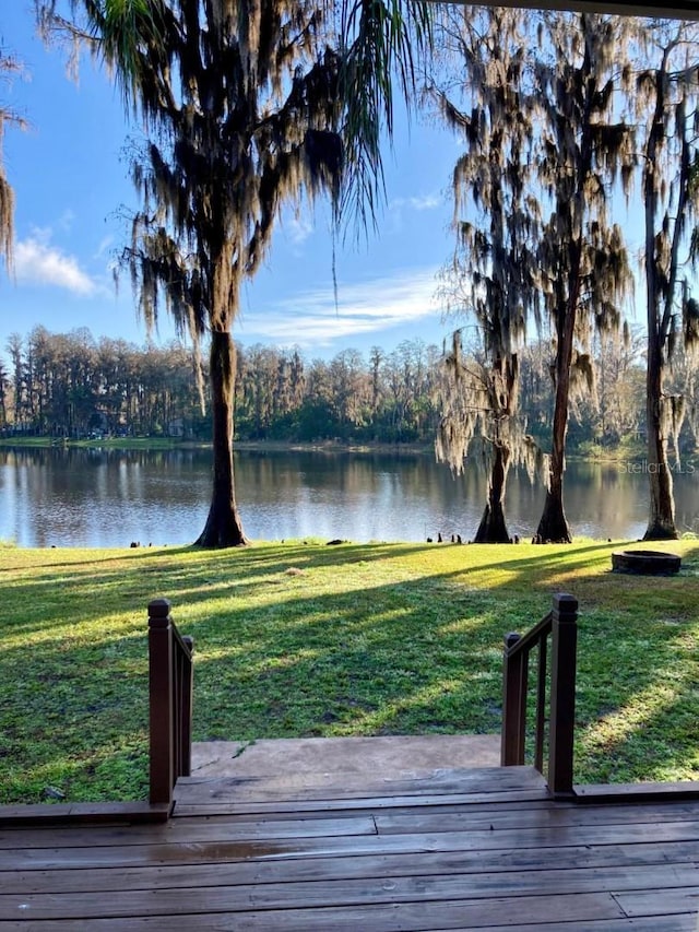 18101 Boy Scout Rd, Odessa, FL 33556 - wooden deck featuring a water view and a yard