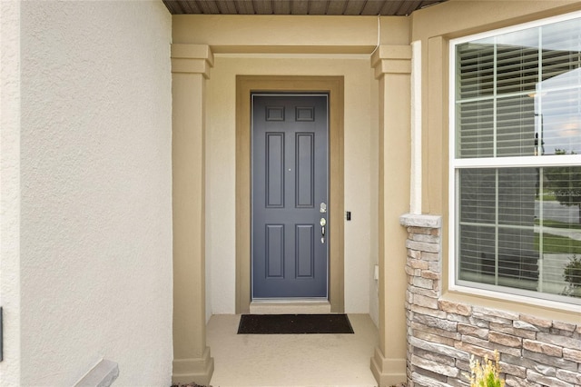 9478 SW 52nd Loop, Ocala, FL 34481 - doorway to property featuring stone siding and stucco siding