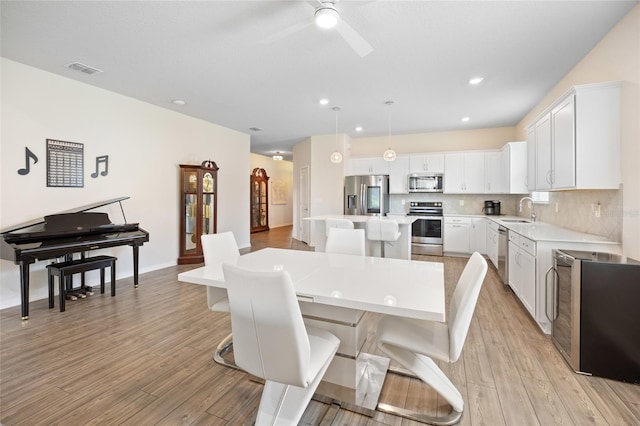 9478 SW 52nd Loop, Ocala, FL 34481 - dining room featuring ceiling fan, light wood-type flooring, and recessed lighting