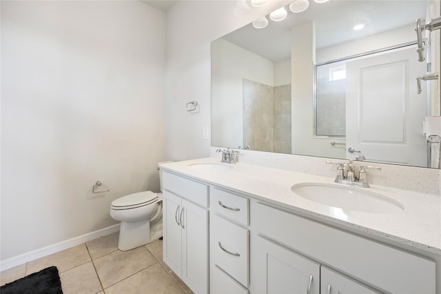 9478 SW 52nd Loop, Ocala, FL 34481 - bathroom with tile patterned flooring, double vanity, toilet, and baseboards