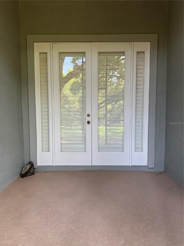 1848 NW 34th St Unit 23, Gainesville, FL 32605 - doorway to property featuring french doors and a patio area