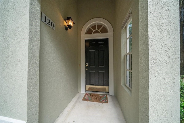 10000 SW 52nd Ave Unit 120, Gainesville, FL 32608 - property entrance with stucco siding