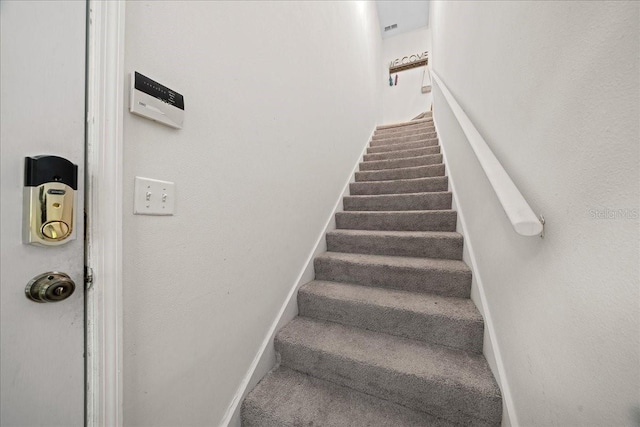 10000 SW 52nd Ave Unit 120, Gainesville, FL 32608 - stairway featuring carpet flooring and baseboards