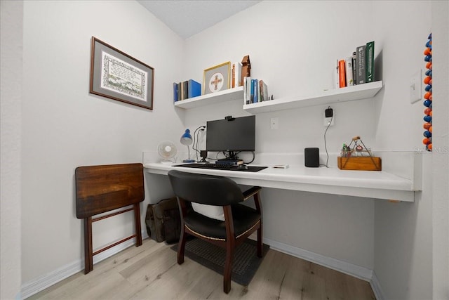 10000 SW 52nd Ave Unit 120, Gainesville, FL 32608 - office with wood finished floors, baseboards, and built in desk