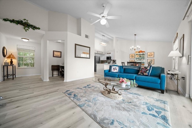 10000 SW 52nd Ave Unit 120, Gainesville, FL 32608 - living area featuring light wood-style floors, a chandelier, ceiling fan, high vaulted ceiling, and baseboards