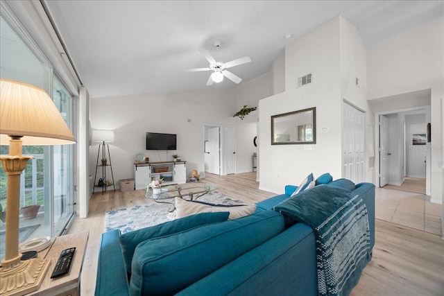 10000 SW 52nd Ave Unit 120, Gainesville, FL 32608 - living area featuring high vaulted ceiling, ceiling fan, and wood finished floors