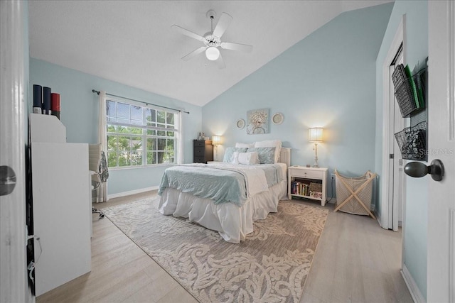 10000 SW 52nd Ave Unit 120, Gainesville, FL 32608 - bedroom with wood finished floors, baseboards, ceiling fan, and high vaulted ceiling