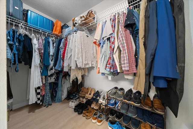 10000 SW 52nd Ave Unit 120, Gainesville, FL 32608 - spacious closet featuring wood finished floors