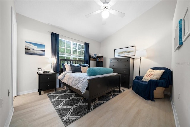 10000 SW 52nd Ave Unit 120, Gainesville, FL 32608 - bedroom with light wood finished floors, baseboards, a ceiling fan, and high vaulted ceiling
