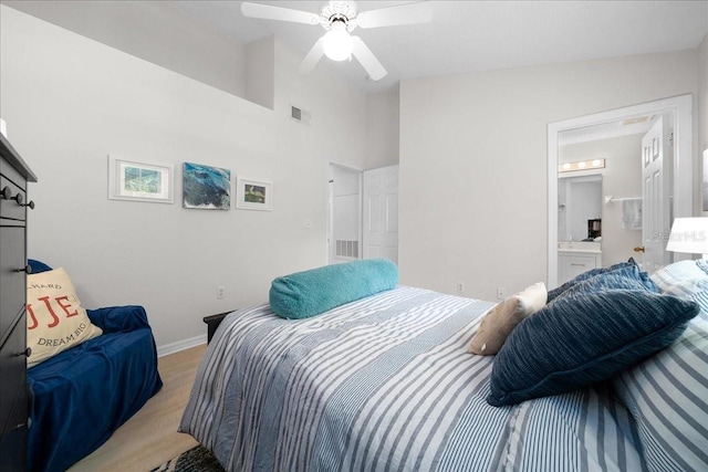 10000 SW 52nd Ave Unit 120, Gainesville, FL 32608 - bedroom with baseboards, ceiling fan, and ensuite bath