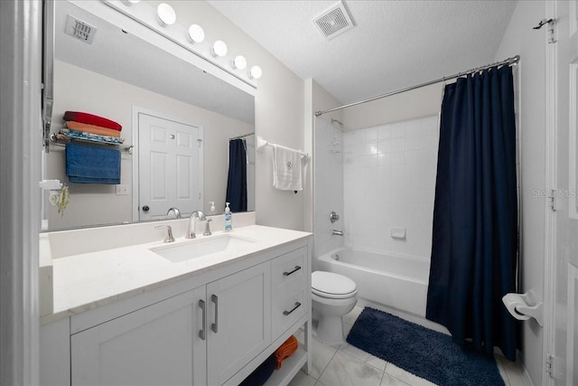 10000 SW 52nd Ave Unit 120, Gainesville, FL 32608 - full bathroom featuring vanity, shower / tub combo with curtain, toilet, and a textured ceiling