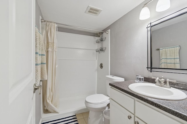 507 NW 39th Rd Unit 154, Gainesville, FL 32607 - full bath with vanity, a tile shower, toilet, and tile patterned floors