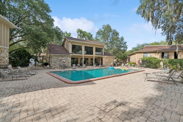 507 NW 39th Rd Unit 154, Gainesville, FL 32607 - community pool with a patio area