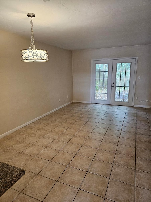4007 SW 26th Ter Unit B, Gainesville, FL 32608 - empty room with light tile patterned floors and baseboards