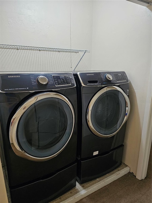 4007 SW 26th Ter Unit B, Gainesville, FL 32608 - laundry area featuring independent washer and dryer and carpet