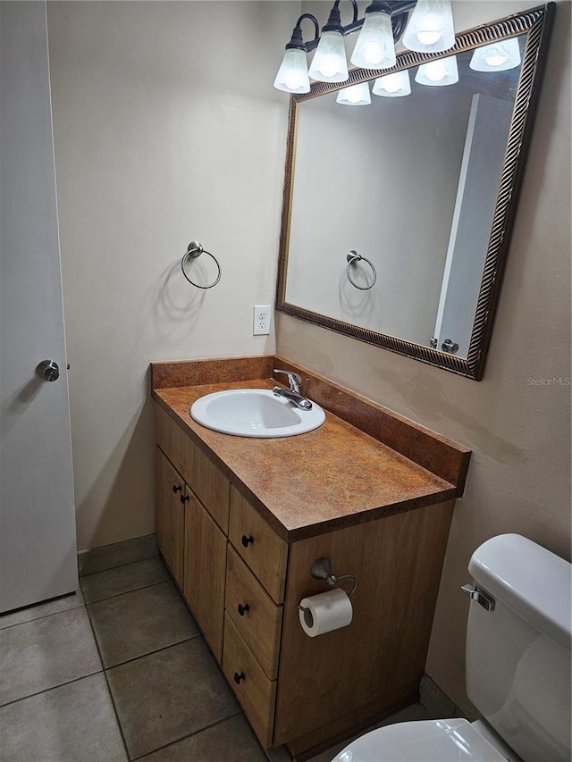 4007 SW 26th Ter Unit B, Gainesville, FL 32608 - bathroom featuring toilet, vanity, and tile patterned flooring