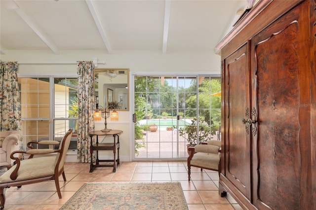 12832 SW 14th Ave, Newberry, FL 32669 - doorway with beamed ceiling and light tile patterned flooring