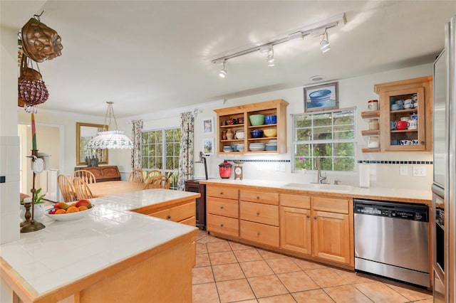 12832 SW 14th Ave, Newberry, FL 32669 - kitchen featuring stainless steel dishwasher, open shelves, tile counters, a sink, and ornamental molding