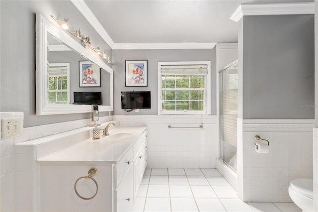 12832 SW 14th Ave, Newberry, FL 32669 - bathroom featuring tile walls, tile patterned flooring, vanity, ornamental molding, and a shower stall