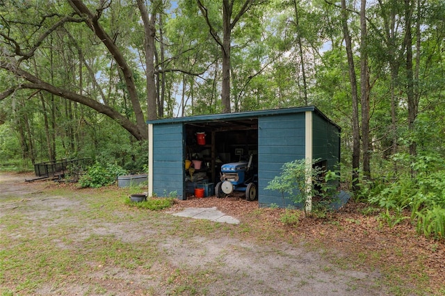 12832 SW 14th Ave, Newberry, FL 32669 - view of outbuilding featuring a wooded view