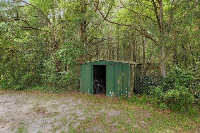 12832 SW 14th Ave, Newberry, FL 32669 - view of shed featuring a view of trees