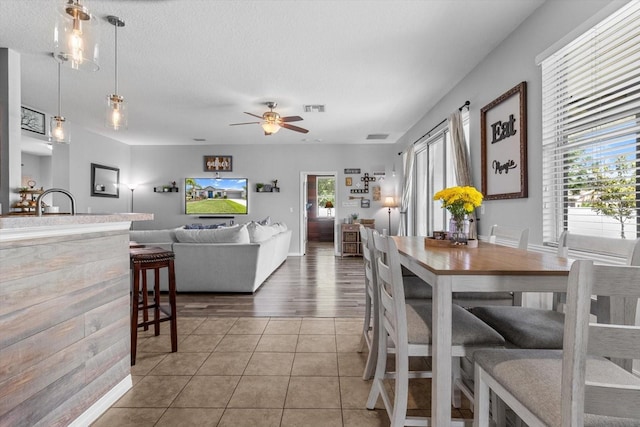 13365 Chesapeake Pl, Spring Hill, FL 34609 - dining space featuring a ceiling fan, tile patterned flooring, and baseboards