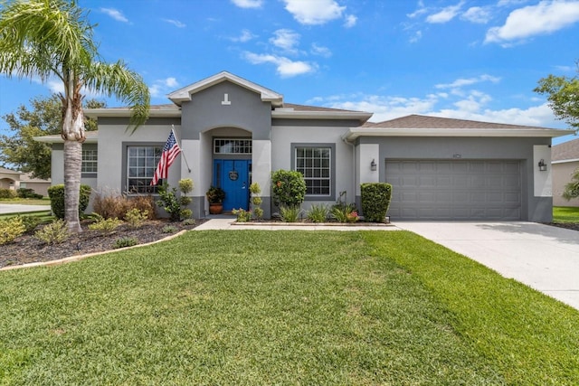 13365 Chesapeake Pl, Spring Hill, FL 34609 - view of front of property with a garage, stucco siding, driveway, and a front lawn