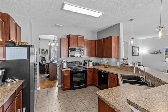 13365 Chesapeake Pl, Spring Hill, FL 34609 - kitchen featuring black appliances, a sink, light countertops, hanging light fixtures, and a textured ceiling
