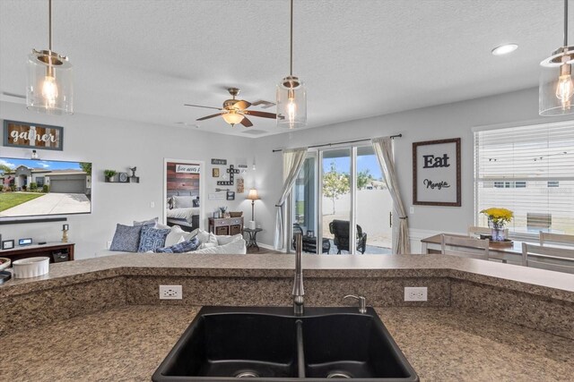 13365 Chesapeake Pl, Spring Hill, FL 34609 - kitchen with ceiling fan, a textured ceiling, open floor plan, hanging light fixtures, and recessed lighting
