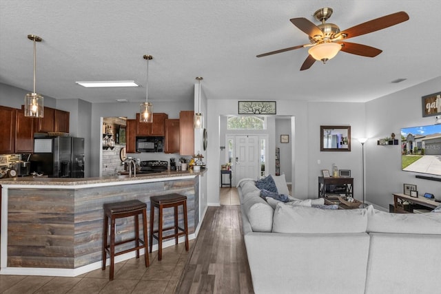 13365 Chesapeake Pl, Spring Hill, FL 34609 - living area featuring ceiling fan and wood finished floors