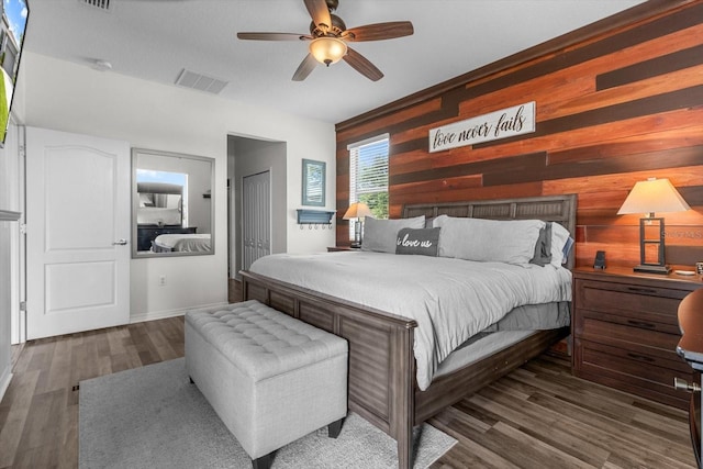 13365 Chesapeake Pl, Spring Hill, FL 34609 - bedroom featuring wood finished floors, wooden walls, and ceiling fan