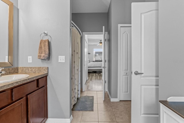 13365 Chesapeake Pl, Spring Hill, FL 34609 - full bathroom featuring vanity, tile patterned floors, baseboards, connected bathroom, and a ceiling fan
