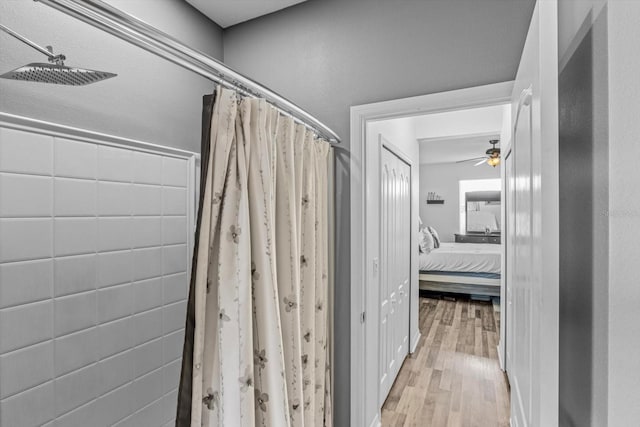 13365 Chesapeake Pl, Spring Hill, FL 34609 - ensuite bathroom featuring wood finished floors, a ceiling fan, and a shower with curtain