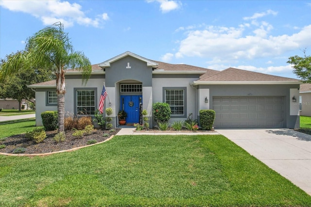 13365 Chesapeake Pl, Spring Hill, FL 34609 - view of front of house with a garage, driveway, stucco siding, and a front yard