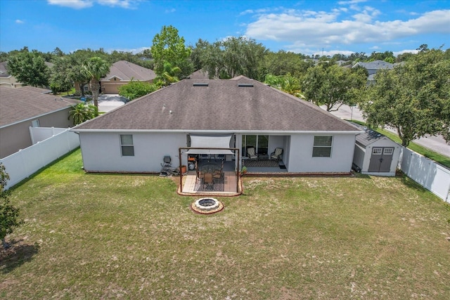 13365 Chesapeake Pl, Spring Hill, FL 34609 - rear view of property with roof with shingles, a fire pit, stucco siding, and a patio