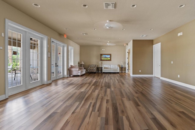 13365 Chesapeake Pl, Spring Hill, FL 34609 - sitting room featuring french doors, baseboards, wood finished floors, and recessed lighting